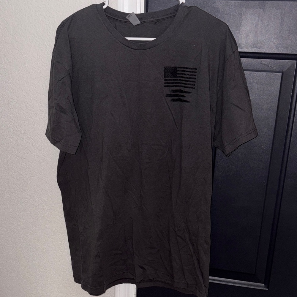 T-Shirt with Subtle Flag Graphic and “Hell’s Coming With Me” quote on the back.